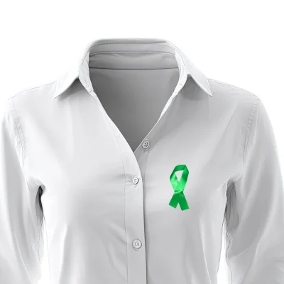 green awareness ribbon on a shirt
