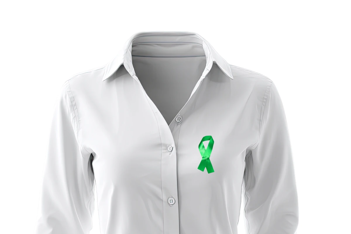 green awareness ribbon on a shirt